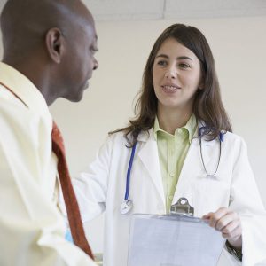 Doctor visiting with patient