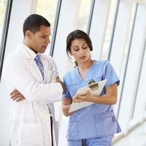Doctor and nurse chatting