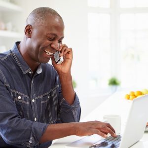 Man talking on the phone at home